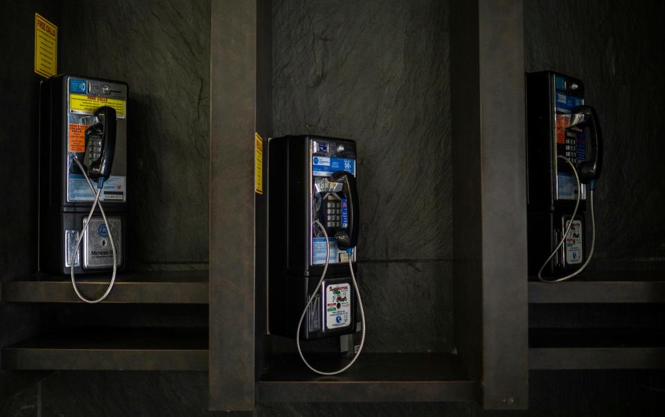 Three pay phones rest inside the Frank Murphy Hall of Justice in Detroit on Saturday, Dec. 9, 2023.