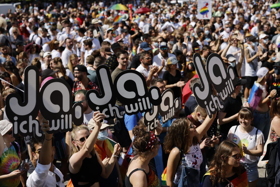 FILE - In this Saturday, Sept. 4, 2021 file photo, people gather for the Zurich Pride parade in Zurich, Switzerland. Swiss voters will wrap up a referendum on Sunday Sept. 26, 2021, to decide whether to allow same-sex marriage in the rich Alpine country, with supporters hoping for a big step toward ending discrimination against gays and lesbians while opponents fear what they consider an erosion of traditional family values. (Michael Buholzer/Keystone via AP, File)