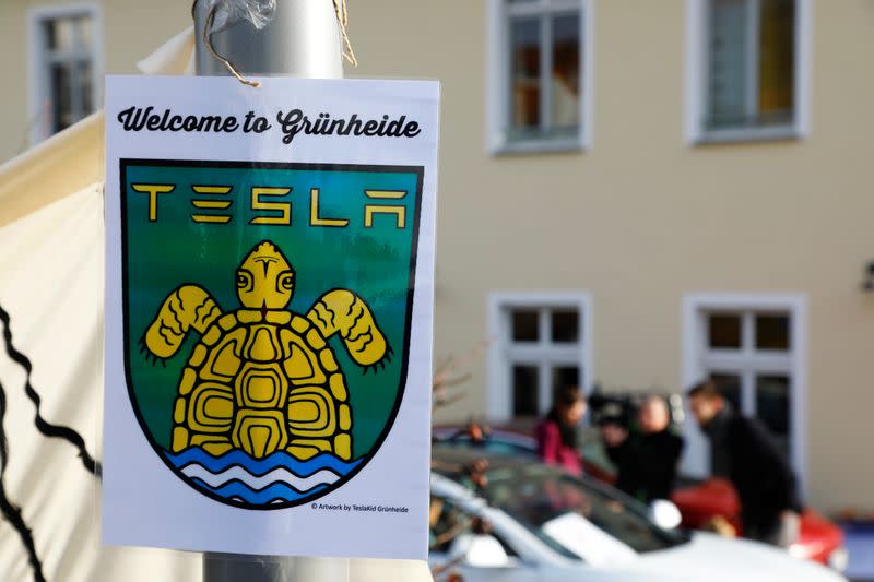 A pro-Tesla poster is seen during an action to support plans by U.S. electric vehicle pioneer Tesla to build its first European factory and design center in Gruenheide near Berlin