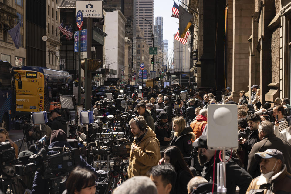 Members of media gather outside Trump Tower in New York, Monday, April. 3, 2023. (AP Photo/Yuki Iwamura)