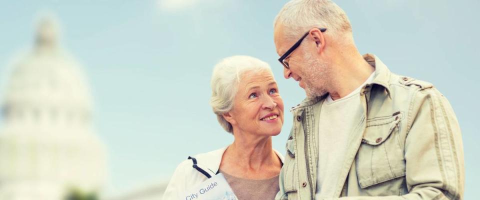 family, age, tourism, travel and people concept - happy senior couple with map over washington white house background