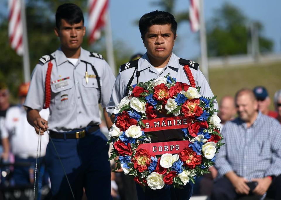 Gumecindo Cruz and Gavin Cruz of Southeast High’s JROTC carry a wreath during the Memorial Day 2016 service held at the Veteran’s Monument in Bradenton.