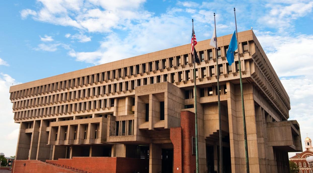 <span class="caption">Organizations can apply to have their flag temporarily replace the Boston city flag, shown on far right, in front of City Hall.</span> <span class="attribution"><a class="link " href="https://www.gettyimages.com/detail/photo/city-hall-in-boston-ma-royalty-free-image/182905783?adppopup=true" rel="nofollow noopener" target="_blank" data-ylk="slk:gregobagel/iStock via Getty Images Plus;elm:context_link;itc:0;sec:content-canvas">gregobagel/iStock via Getty Images Plus</a></span>