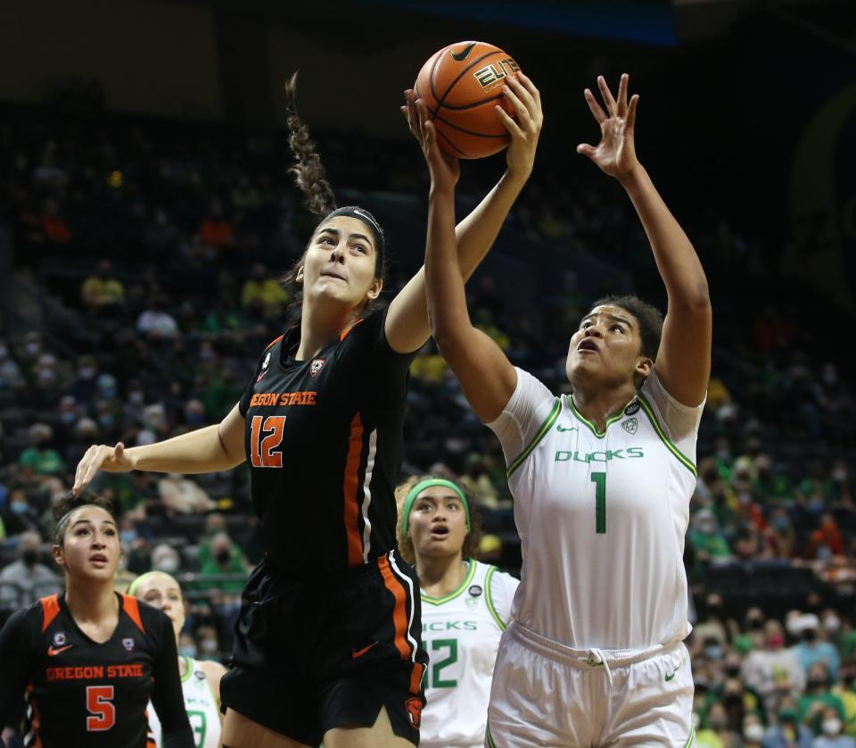 Oregon State's Jelena Mitrovic, left, and Oregon's Nyara Sabally battle for a rebound during the second half Feb. 13, 2022.