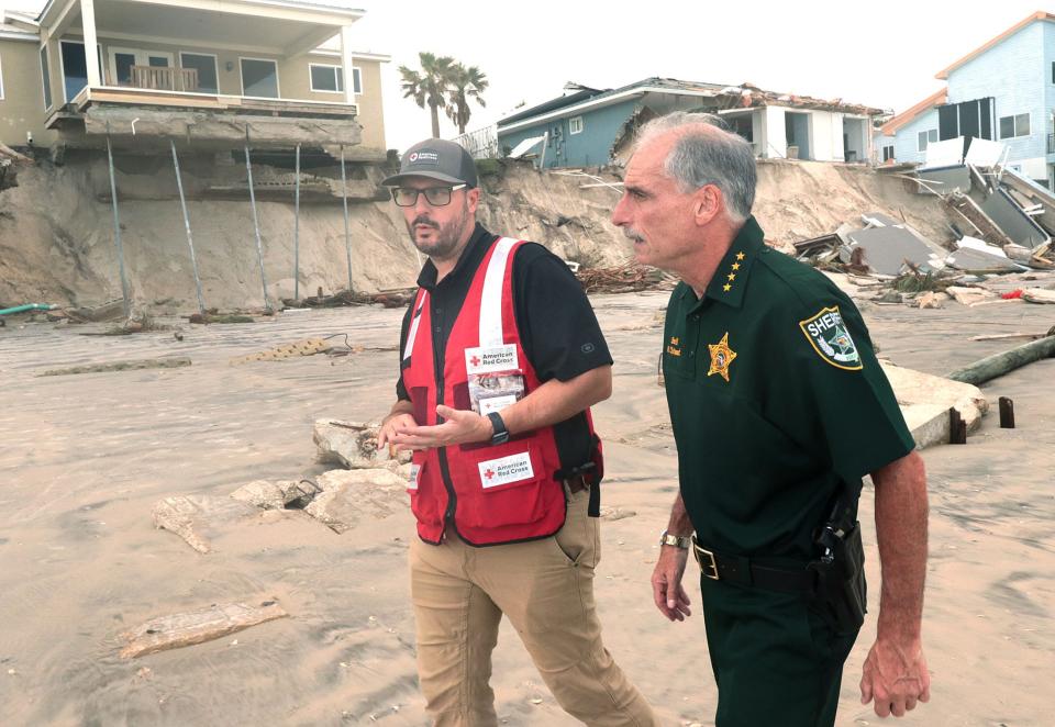 American Red Cross  Executive Directror Brice Johnson talks with Volusia County Sheriff Mike Chitwood as they checkout Hurricane Nicole damaged homes, Friday November 11, 2022 in Wilbur-by-the-Sea.
