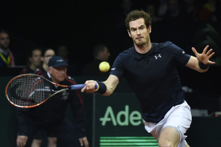 Britain's Andy Murray returns the ball to Belgium's David Goffin during their tennis match on the third day of the Davis Cup final between Belgium and Britain at Flanders Expo in Ghent on November 29, 2015