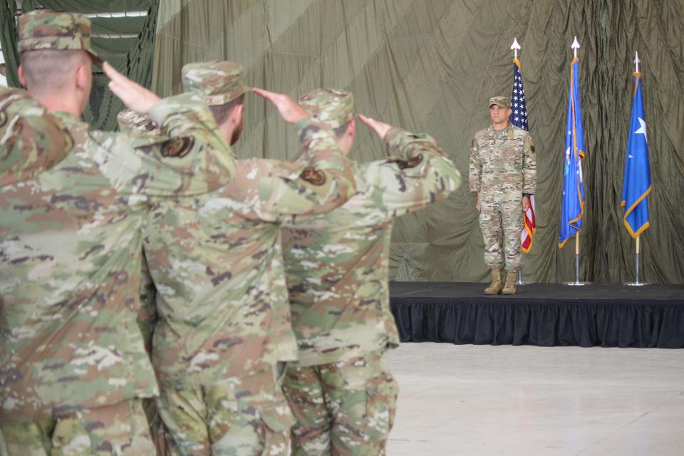 Col. Robert L. Johnston receives his first salute as commander of the U.S. Air Force 27th Special Operations Wing during a change of command ceremony Monday, July 15, 2024 at Cannon Air Force Base, N.M.
