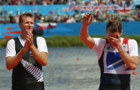 Gold medallist Mahe Drysdale (L) of New Zealand applauds as bronze medallist Alan Campbell of Britain reacts during a ceremony after the Men's Single Sculls Final event during the London 2012 Olympic Games at Eton Dorney August 3, 2012. REUTERS/Brian Snyder (BRITAIN - Tags: OLYMPICS SPORT ROWING) 