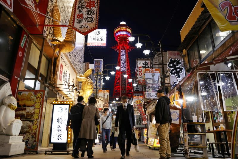 FILE PHOTO: Pedestrians are seen in front of the Tsutenkaku Tower in Osaka