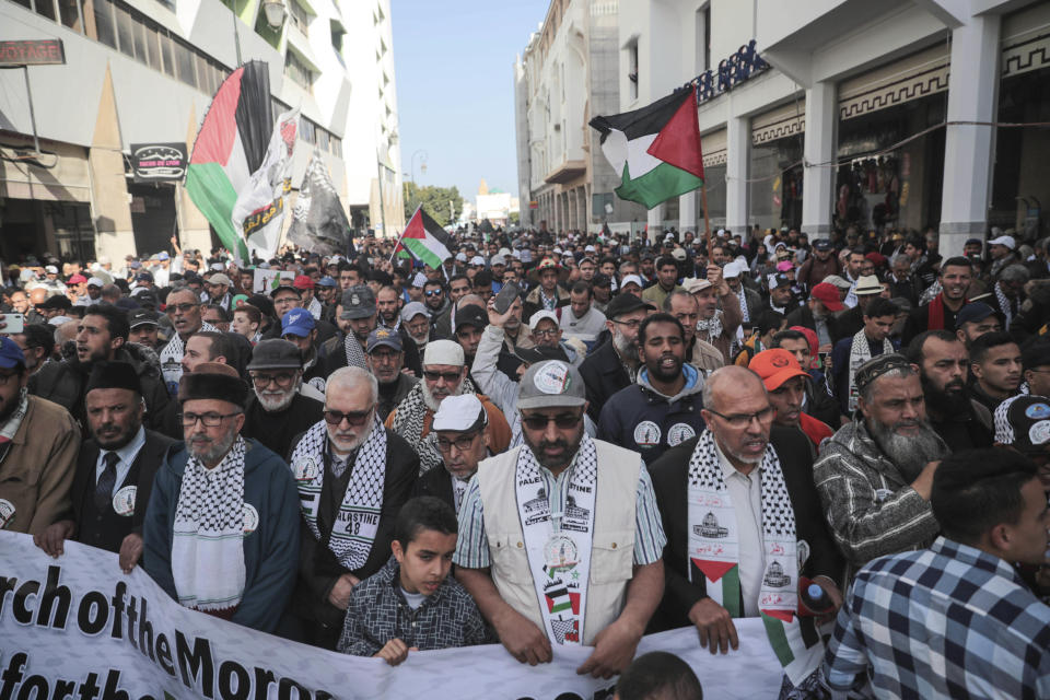 People gather for a demonstration in Rabat, Morocco, Sunday, Feb. 9, 2020. Thousands of Moroccans took part in a march rejecting Trump's Middle East peace plan and in support of Palestinians. (AP Photo/Mosa'ab Elshamy)