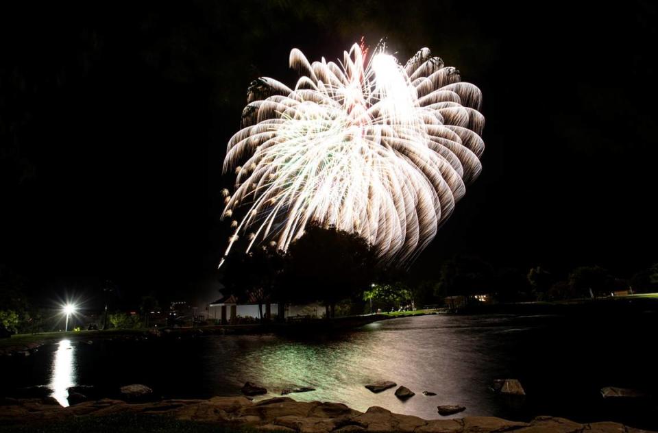 Fireworks light up the sky over the lake at Barney Schwartz Park in Paso Robles on Tuesday, July 4, 2023.