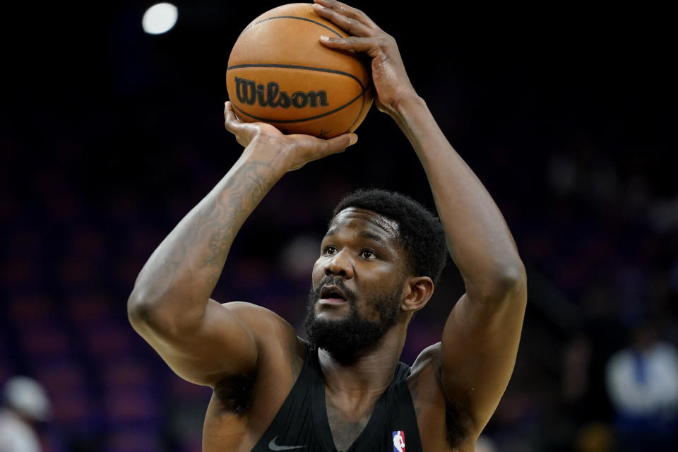 FILE -Phoenix Suns center Deandre Ayton during warmups before Game 1 in the second round of the NBA Western Conference playoff series against the Dallas Mavericks, Monday, May 2, 2022, in Phoenix. The Indiana Pacers have agreed to sign restricted free agent Deandre Ayton to a four-year, $133 million offer sheet, giving the Phoenix Suns two days to match the offer — or lose the center it selected with the top overall pick in the 2018 NBA draft.(AP Photo/Matt York, File)