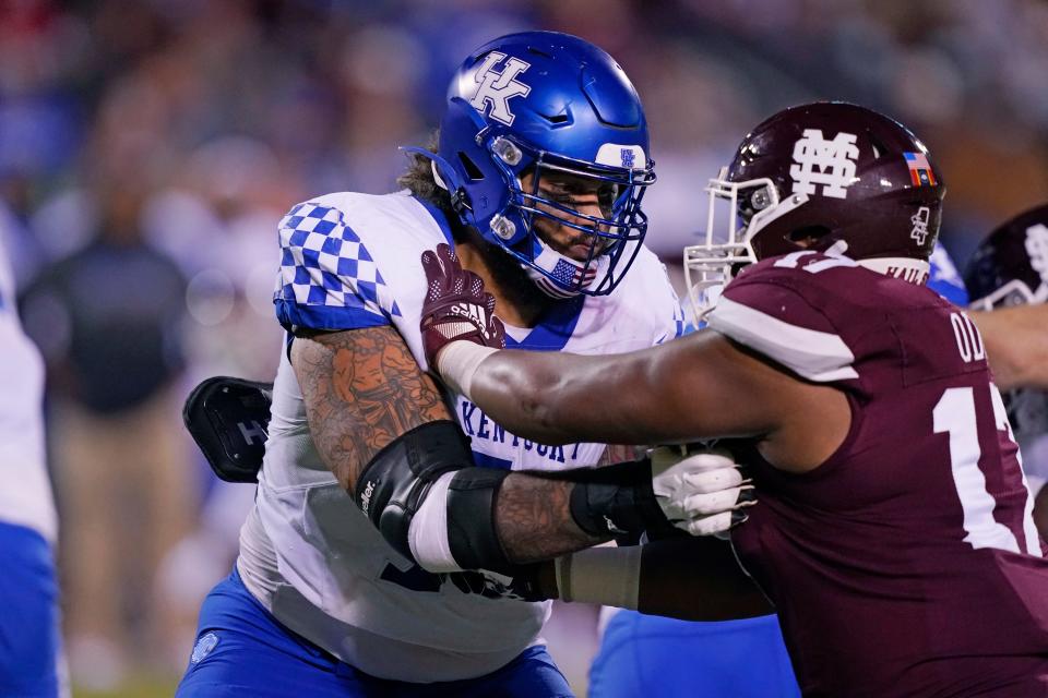 Kentucky offensive tackle Darian Kinnard (70) blocks Mississippi State defensive end Aaron Odom (17) during the second half of an NCAA college football game in Starkville, Miss., Saturday, Oct. 29, 2021. Mississippi State won 31-17. (AP Photo/Rogelio V. Solis)