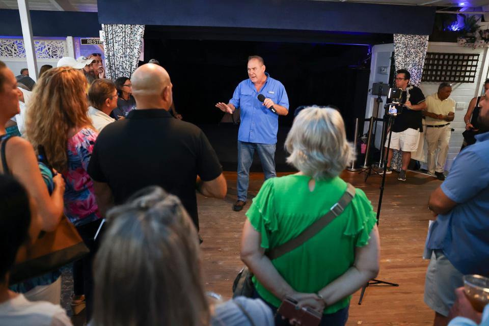 Casey Cass, owner of Casco Tools in Port Salerno, speaks to concerned residents at Pirates Cove Resort and Marina on Thursday, Sept. 14, 2023, in Port Salerno. The front is led by the group Save Our Salerno.