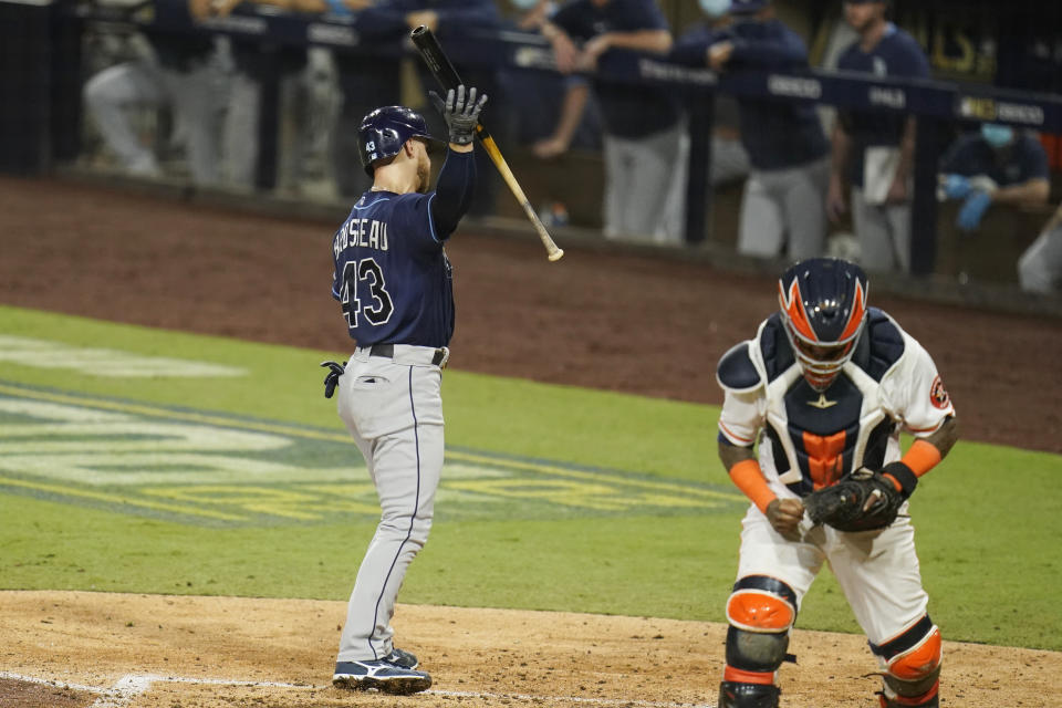 Houston Astros catcher Martin Maldonado reacts after Tampa Bay Rays' Michael Brosseau struck out with bases loaded during the sixth inning in Game 4 of a baseball American League Championship Series, Wednesday, Oct. 14, 2020, in San Diego. (AP Photo/Gregory Bull)