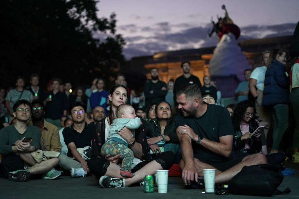 FILE - England supporters watch a live screening of the Women's Euro 2022 semifinal soccer match between England and Sweden at the fan area in Trafalgar Square in London, England, Tuesday, July 26, 2022. The march to Sunday's final against Germany has energized people throughout England, with the team's pinpoint passing and flashy goals attracting record crowds, burgeoning TV ratings and adoring coverage. The Lionesses, as the team is known, have been a welcome distraction from the political turmoil and cost-of-living crisis that dominate the headlines. (AP Photo/Albert Pezzali, File)