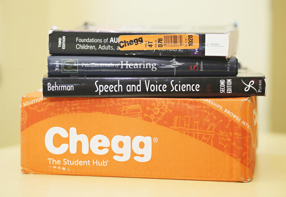 Kay Caprez, Kent State senior speech and pathology major, shows her Chegg books in the Kent State Library on Monday, Oct. 20, 2016 in Kent, Ohio. Caprez rents most of her textbooks from the online rental site. (Leah Klafczynski/Akron Beacon Journal/Tribune News Service via Getty Images)