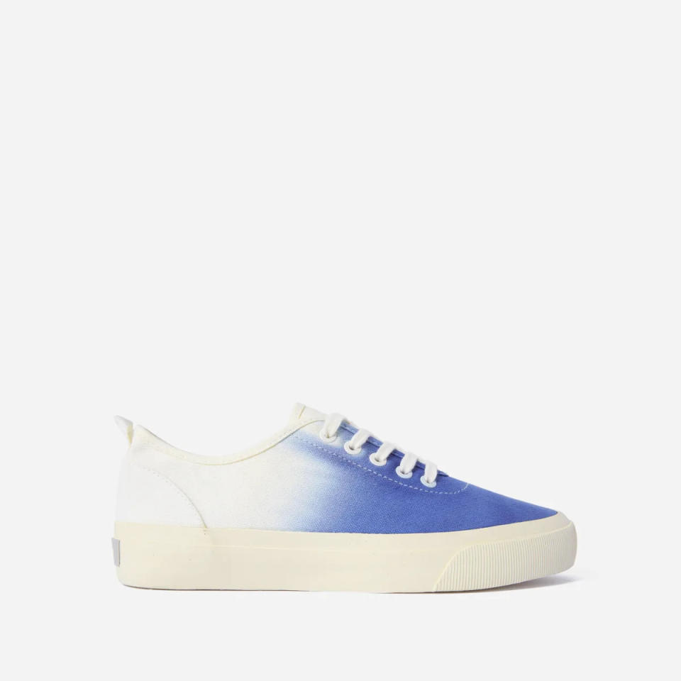 The Forever Sneaker in white with blue dip. Image via Everlane.
