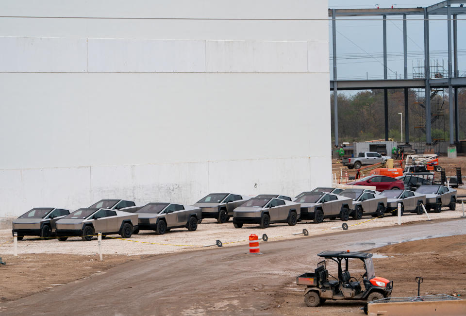 Newly manufactured Tesla Cybertrucks are parked outside the company's Giga Texas factory on December 13, 2023, in Austin, Texas. Tesla began customer deliveries of the Cybertruck on November 30, 2023, bringing to fruition an Elon Musk passion project that the billionaire boasts is stronger than bullets and faster than a Porsche. (Photo by SUZANNE CORDEIRO / AFP) (Photo by SUZANNE CORDEIRO/AFP via Getty Images)