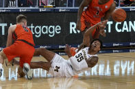 Michigan guard Eli Brooks (55) passes the ball as Bowling Green guard Kaden Metheny (5) defends during the first half of an NCAA college basketball game, Wednesday, Nov. 25, 2020, in Ann Arbor, Mich. (AP Photo/Carlos Osorio)