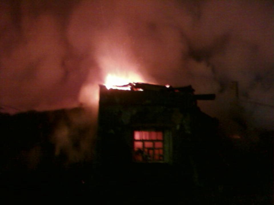 A general view of a psychiatric hospital on fire in the Novgorod region town of Luka is seen in this September 13, 2013 picture provided by the Russian Emergencies Ministry. The fire raged through the Russian psychiatric hospital on Friday, killing at least one person and leaving dozens missing as police searched the surrounding area for survivors, emergency and law enforcement officials said. Picture taken with a mobile phone. (REUTERS/Russian Emergencies Ministry of Novgorod region/Handout via Reuters)