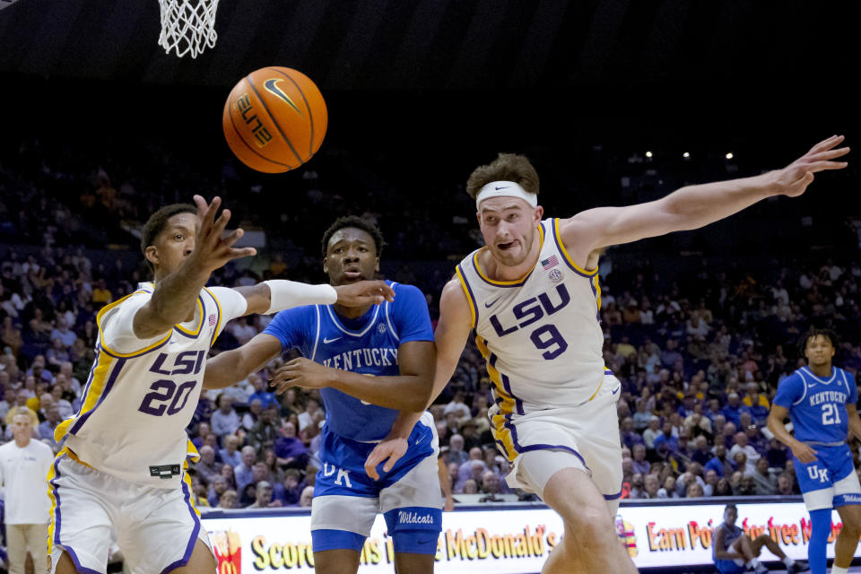 LSU forward Derek Fountain (20) and Kentucky guard Adou Thiero, and forward Will Baker (9) go after a rebound during the first half of an NCAA college basketball game Wednesday, Feb. 21, 2024, in Baton Rouge, La. (AP Photo/Matthew Hinton)