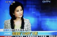 A TV grab from CCTV taken on May 7, shows He Jia, an anchor for China Central Television's news broadcast, when she claimed the Philippines as part of China during a late broadcast that has been repeatedly replayed on the Internet