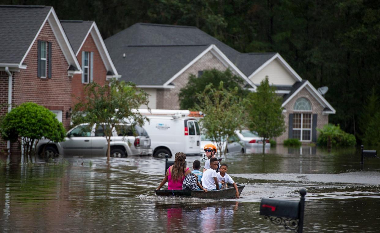 FILE - Pooler Fire Department boats residents of homes on Tappan Zee Drive after heavy flooding in the area of Pooler due to Hurricane Matthew. For many coastal homeowners, flooding can be a large cost.