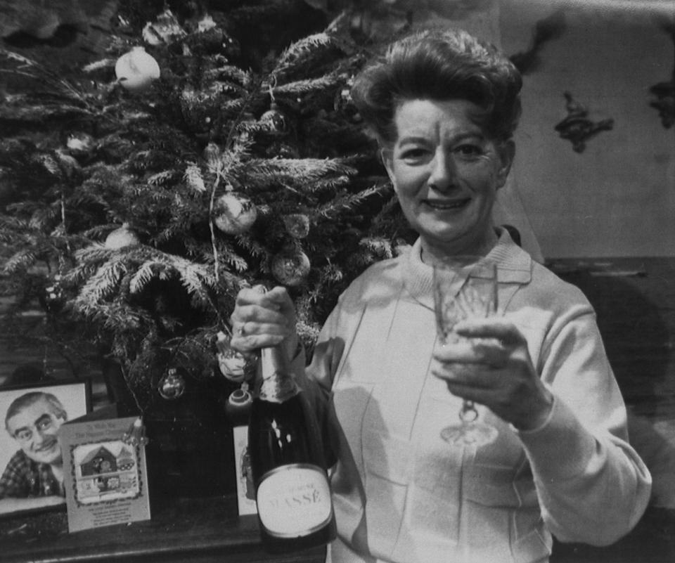 Actress Jean Alexander says farewell with a seasonal drink as she prepares for her last appearance in television's 'Coronation Street' at Granada Television in Manchester. She is leaving the soap-opera after 23 years of playing Hilda Ogden.   (Photo by PA Images via Getty Images)