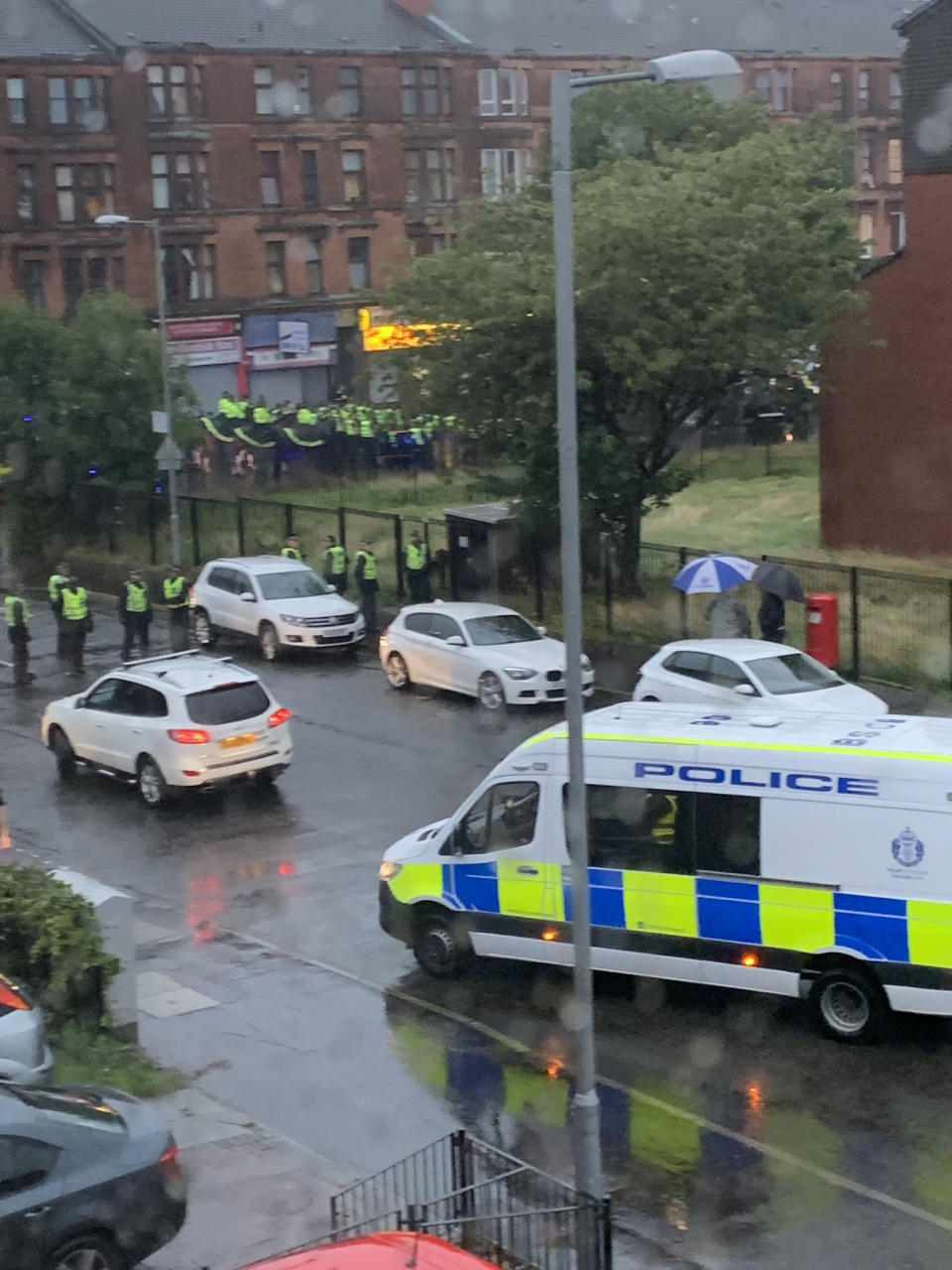 Govan Road in Glasgow was blocked by police as trouble flared following a Irish unity march and counter protest (Picture: PA)