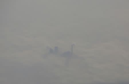 A thermal power plant is pictured amid heavy smog, from an aircraft over Hebei province, China, January 2, 2017. REUTERS/Jason Lee