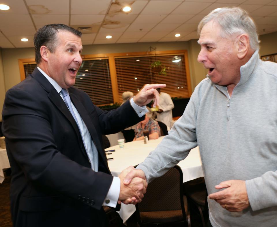 From left, Mayor Robert Sullivan with supporter Chuck Vegal after he was re-elected on Tuesday, Nov. 8, 2023 and celebrated at Tommy Doyle's at Sidelines.