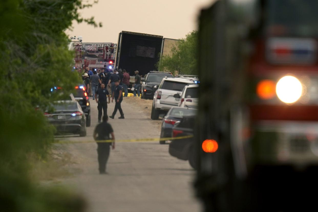 Body bags lie at the scene where a tractor trailer with multiple dead bodies was discovered on Monday, June 27, 2022, in San Antonio.