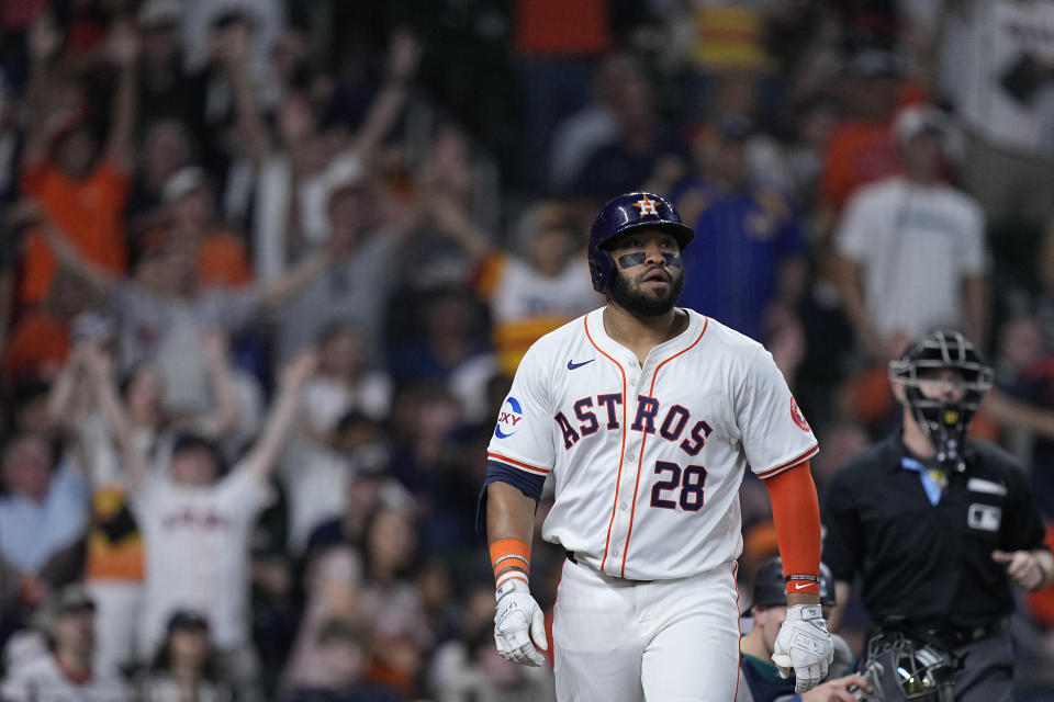 Houston Astros' Jon Singleton watchers his go-ahead two-run home run during the seventh inning of a baseball game against the Seattle Mariners, Sunday, May 5, 2024, in Houston. (AP Photo/Kevin M. Cox)