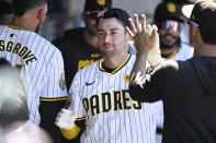 San Diego Padres' Kyle Higashioka (20) is congratulated after hitting a solo home run during the fourth inning of a baseball game against the St. Louis Cardinals, Wednesday, April 3, 2024, in San Diego. (AP Photo/Denis Poroy)