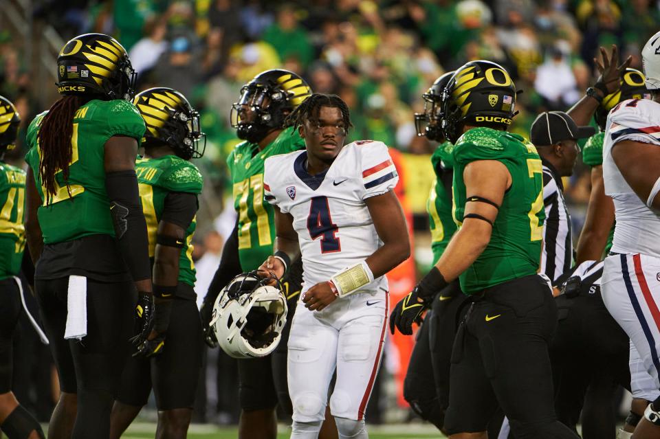 Sep 25, 2021; Eugene, Oregon, USA; Arizona Wildcats quarterback Jordan McCloud (4) loses his helmet during the second half against the Oregon Ducks at Autzen Stadium. The Ducks won the game 41-19.