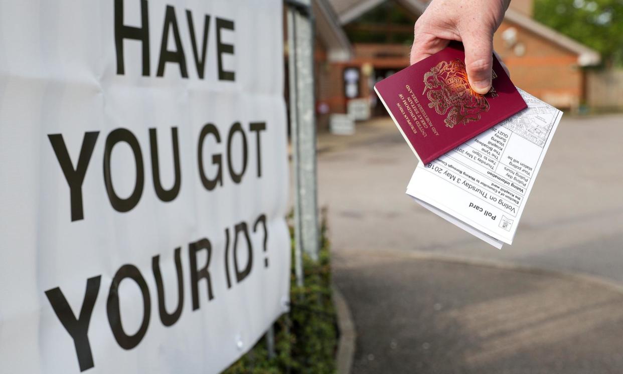 <span>The Electoral Commission also said ministers should consider allowing people without photo ID to vote if someone else vouches for them at the polling station.</span><span>Photograph: Andrew Matthews/PA</span>