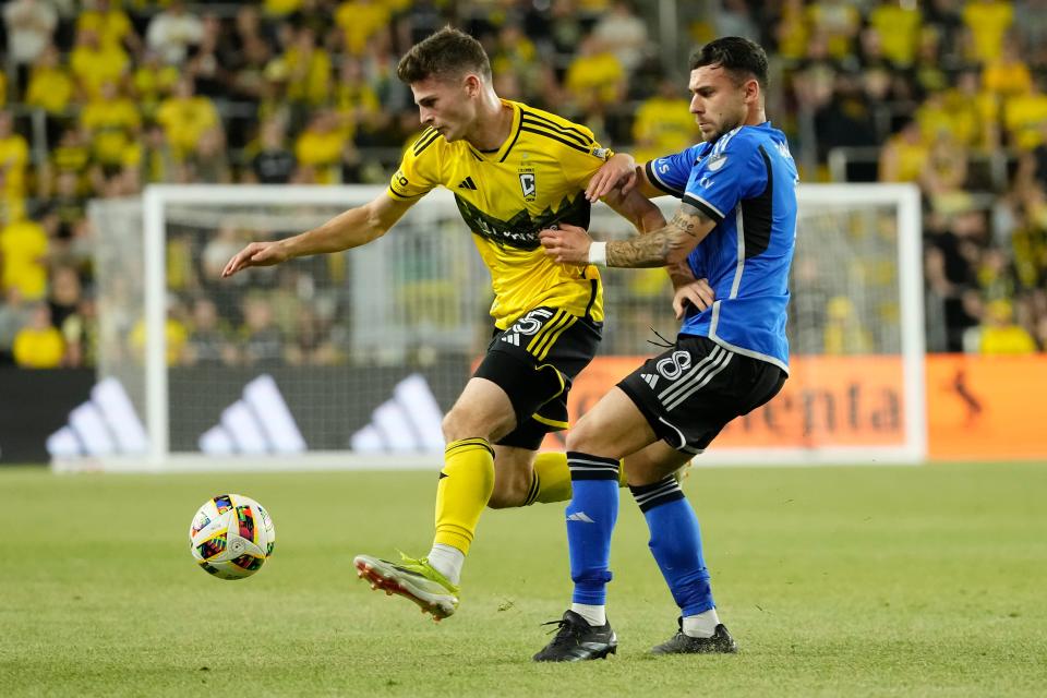 Apr 27, 2024; Columbus, Ohio, USA; Columbus Crew midfielder Sean Zawadzki (25) dribbles past CF Montreal midfielder Dominic Iankov (8) during the second half of the MLS match at Lower.com Field. The teams played to a 0-0 draw.