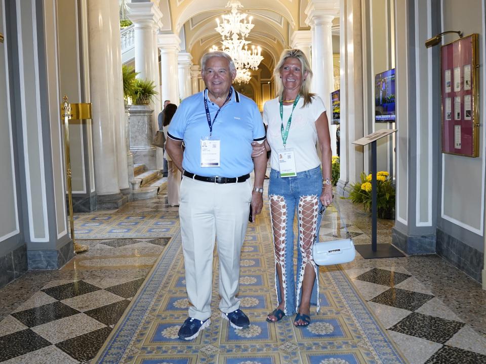 Bob and Nadine Menendez stand on a tiled floor