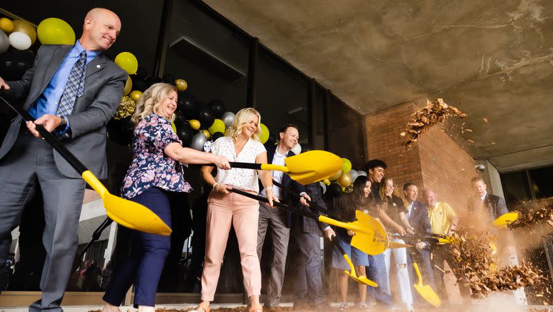 Members of Cottonwood High School’s staff, students and parents dig during a groundbreaking event for a teen resource center at Cottonwood High School in Murray on Thursday, June 1, 2023.