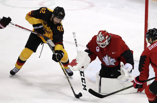 Yasin Ehliz (42), of Germany, shoots at goalie Kevin Poulin (31), of Canada, during the second period of the semifinal round of the men’s hockey game at the 2018 Winter Olympics in Gangneung, South Korea, Friday, Feb. 23, 2018. (AP Photo/Frank Franklin II)