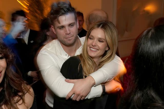 <p>Jeff Kravitz/FilmMagic</p> Leo Woodall and Meghann Fahy after the Emmys in January 2024