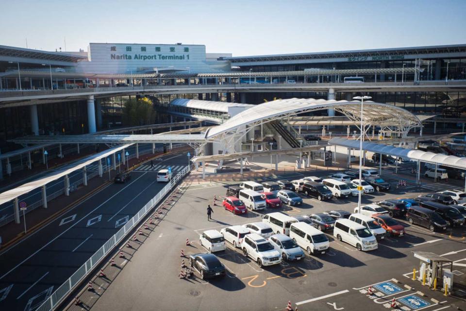 Vehicles parked outside the Terminal 1 building at Narita Airport in Narita, Chiba Prefecture, Japan