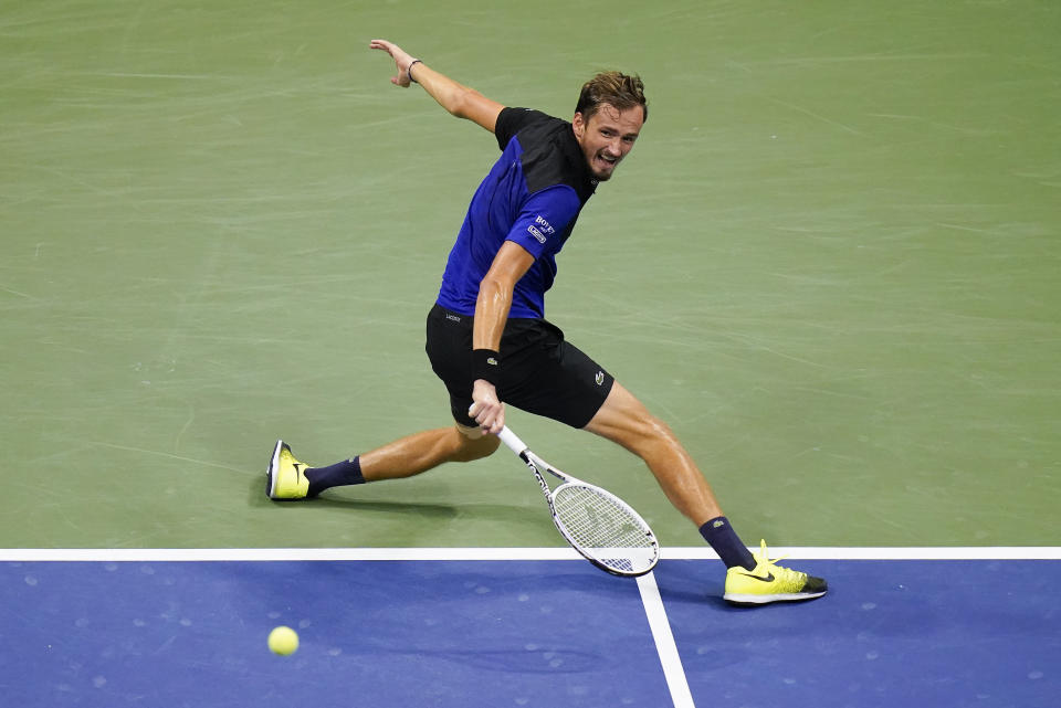 Daniil Medvedev, of Russia, returns a shot to Dominic Thiem, of Austria, during a men's semifinal match of the US Open tennis championships, Friday, Sept. 11, 2020, in New York. (AP Photo/Seth Wenig)