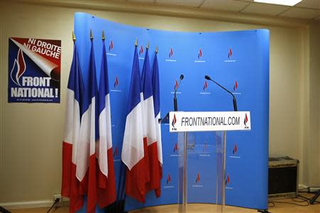 An empty podium is seen at the France's far-right National Front political party's headquarters during the first round in the French mayoral elections in Nanterre, March 23, 2014. REUTERS/Benoit Tessier