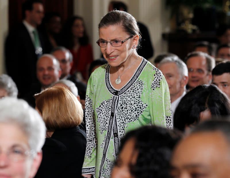 FILE PHOTO: U.S. Supreme Court Justice Ruth Bader Ginsburg is pictured arriving in the audience at a White House reception hosted by U.S. President Barack Obama in Washington