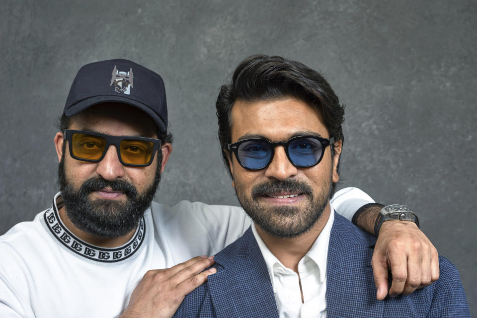 Indian actors N. T. Rama Rao Jr., left, and Ram Charan pose for a photo to promote their film "RRR" on Monday, Jan. 9, 2023, in Los Angeles. (AP Photo/Damian Dovarganes)