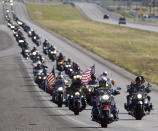 <p>Hundreds of motorcyclists make their way on Highway 191 toward Odessa, Texas on their way to Andrews Monday morning, May 29, 2017 during the Memorial Day Ride to Remember. The ride begins with a ceremony at the Permian Basin Vietnam Memorial and ends with a wreath ceremony at the Andrews War Memorial. (Photo: Mark Sterkel/Odessa American via AP) </p>