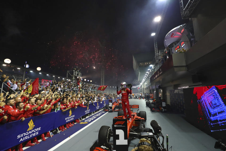 In this Sunday, Sept. 22, 2019, file photo, Ferrari driver Sebastian Vettel of Germany celebrates after winning the Singapore Formula One Grand Prix in Singapore. (AP Photo/Lim Yong Teck, File)