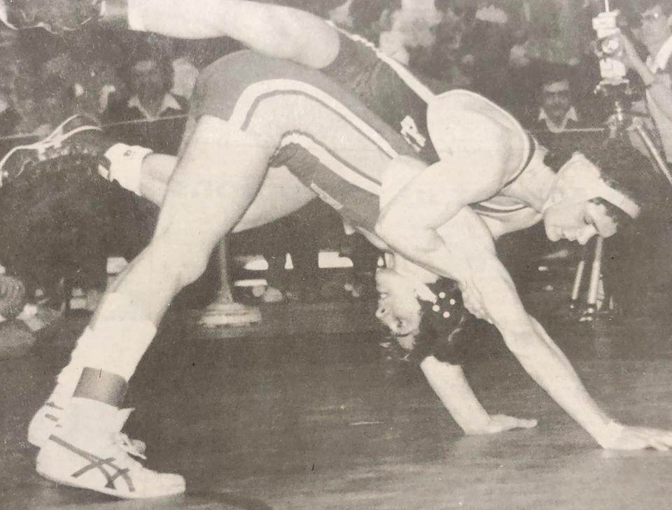 Watertown's Bruce Carter (top) hangs on to Glenn Foster of Sioux Falls Lincoln during their 132-pound championship match in the 1985 state Class A wrestling tournament in Sioux Falls. Carter, a junior, won 5-0.